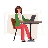 Pretty young woman in a green suit sitting at the desk, working seamlessly from her laptop vector