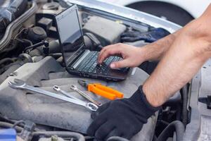 car mechanic repairing a car photo