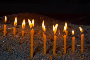 candles in the dark, burning candles in the church photo