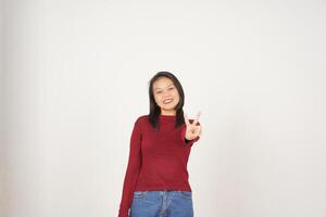 Young Asian woman in Red t-shirt smiling and showing peace or victory sign showing  isolated on white background photo