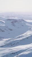 A breathtaking aerial view of snow-covered mountain peaks video