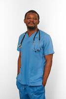 Black surgeon doctor bearded man in blue coat with stethoscope isolated on white background photo