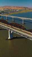 Bridges with highways to both sides. Roads on bridges connecting Martinez to Benicia. Sunny day view from top. Vertical video