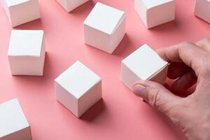 top view of colorful blank paper boxes on pink background. copy space available photo