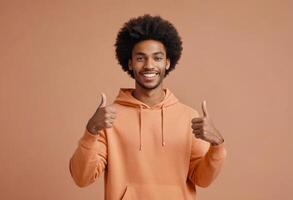 AI Generated Man in a cozy hoodie giving double thumbs up, his afro and joyful expression radiating casual ease and positivity. photo