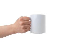 Clean white mug, held by an isolated hand, offers a perfect canvas for Print-on-Demand design promotion. Customizable and versatile photo