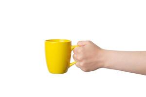 Hand presents a yellow mug, perfect for Print-on-Demand design promotion. Isolated and customizable, ideal for showcasing personalized creations photo