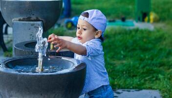 small boy playing in the park photo