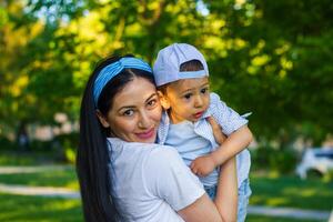 small boy with mother in the park photo