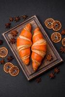 Delicious fresh, crispy French croissants with sweet filling photo