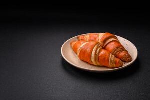 Delicious fresh, crispy French croissants with sweet filling photo