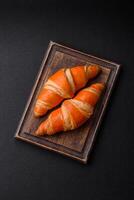 Delicious fresh, crispy French croissants with sweet filling photo