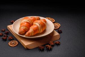 Delicious fresh, crispy French croissants with sweet filling photo