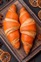 Delicious fresh, crispy French croissants with sweet filling photo