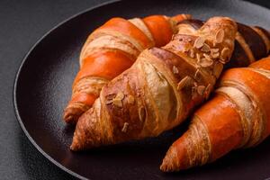 Delicious fresh, crispy French croissants with sweet filling photo