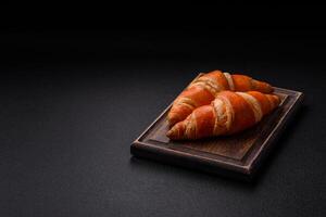 Delicious fresh, crispy French croissants with sweet filling photo