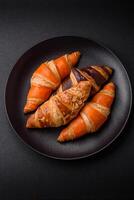 Delicious fresh, crispy French croissants with sweet filling photo