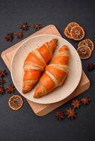 Delicious fresh, crispy French croissants with sweet filling photo