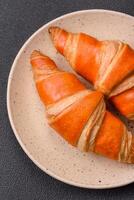 Delicious fresh, crispy French croissants with sweet filling photo