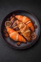 Delicious fresh, crispy French croissants with sweet filling photo