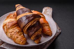 Delicious fresh, crispy French croissants with sweet filling photo