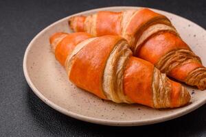 Delicious fresh, crispy French croissants with sweet filling photo