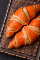 Delicious fresh, crispy French croissants with sweet filling photo