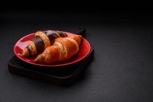 Delicious fresh, crispy French croissants with sweet filling photo