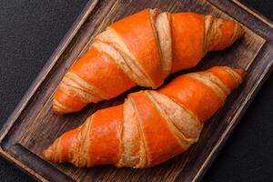 Delicious fresh, crispy French croissants with sweet filling photo