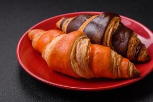 Delicious fresh, crispy French croissants with sweet filling photo