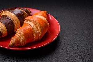 Delicious fresh, crispy French croissants with sweet filling photo