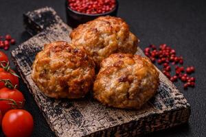 Delicious fresh fried minced fish cutlets with spices and herbs photo