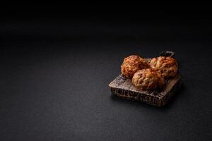 Delicious fresh fried minced fish cutlets with spices and herbs photo