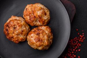 Delicious fresh fried minced fish cutlets with spices and herbs photo