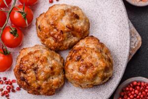 Delicious fresh fried minced fish cutlets with spices and herbs photo