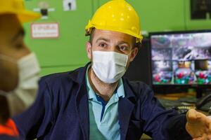 industrial workers at the workstation photo