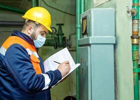 industrial worker at the work in factory photo