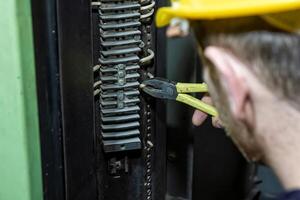 industrial worker at the work in factory photo