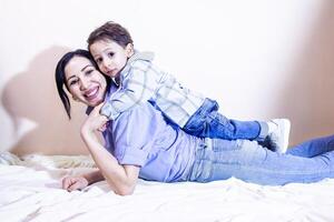 parent and child, mother and child playing together in studio photo