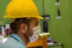 industrial worker at the workstation photo