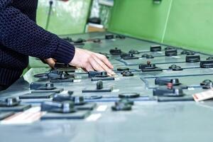 industrial worker at the work in factory photo