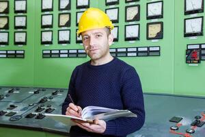 industrial worker at the work in factory photo