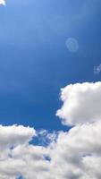 Fluffy small clouds transforming quickly into grey cloudscape. View from below. Timelapse. Vertical video