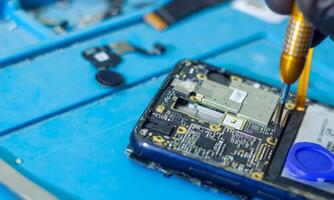 service worker repairing personal computer board photo