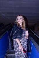the beautiful young woman on the escalator photo