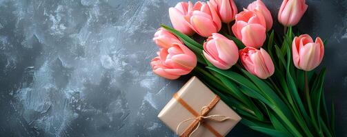 AI generated spring bouquet tulips with giftbox on grey background, spring flat lay photo