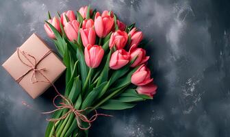 AI generated spring bouquet tulips with giftbox on grey background, spring flat lay photo