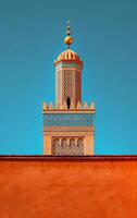 AI generated The fine details of a minaret tower pop against the backdrop of a clear blue sky photo