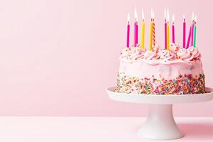AI generated pink cake on a stand with burning candles on a pink background photo