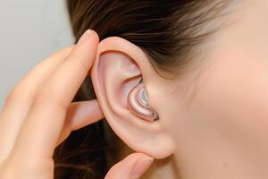 AI generated hearing aid in a woman's ear, close-up photo